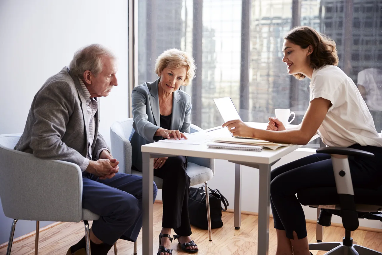 Couple Sitting with Financial Advisor